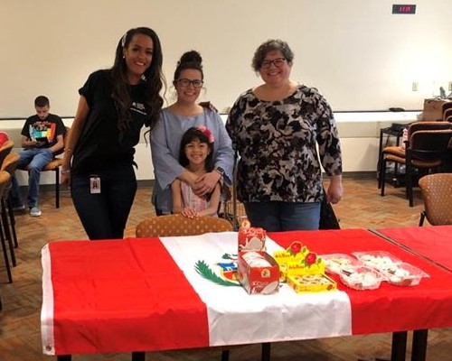 Group of people smiling for a photo at Amigos group